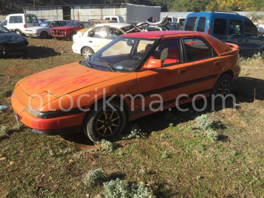 MAZDA 323 H.B SOL ARKA KAPI