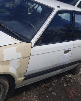 1988 model mazda 323 1.6 çıkma sol ön dolu kapı