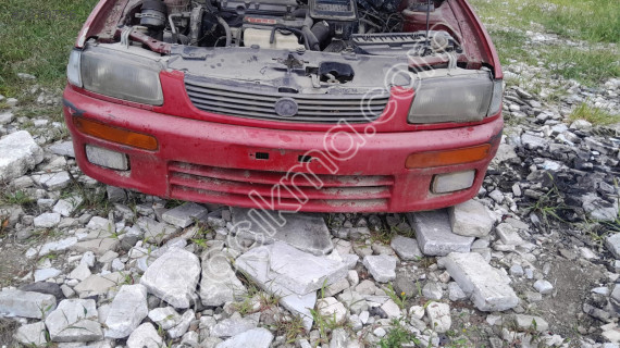 Mazda 323 family ön tampon  dolu çıkma